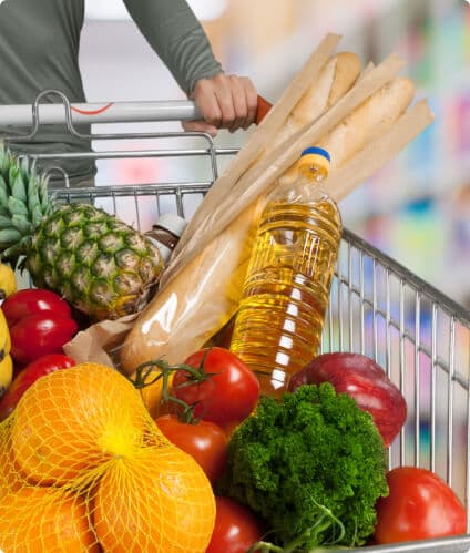 Shopping trolley filled with fresh groceries